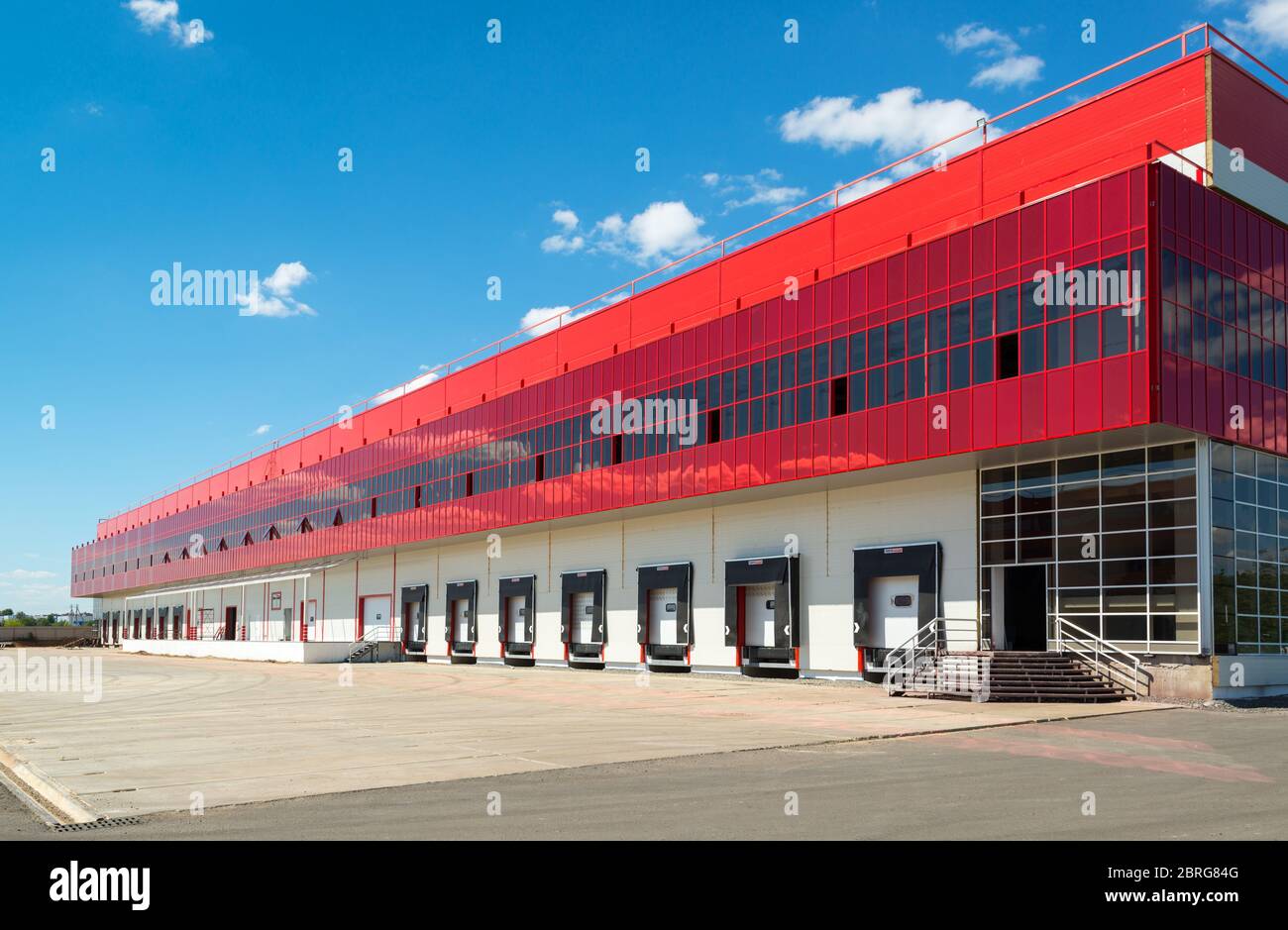Modern warehouse on a background of blue sky Stock Photo