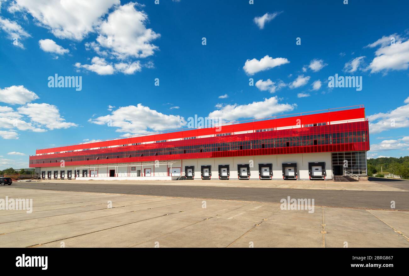 Modern warehouse on a background of blue sky Stock Photo
