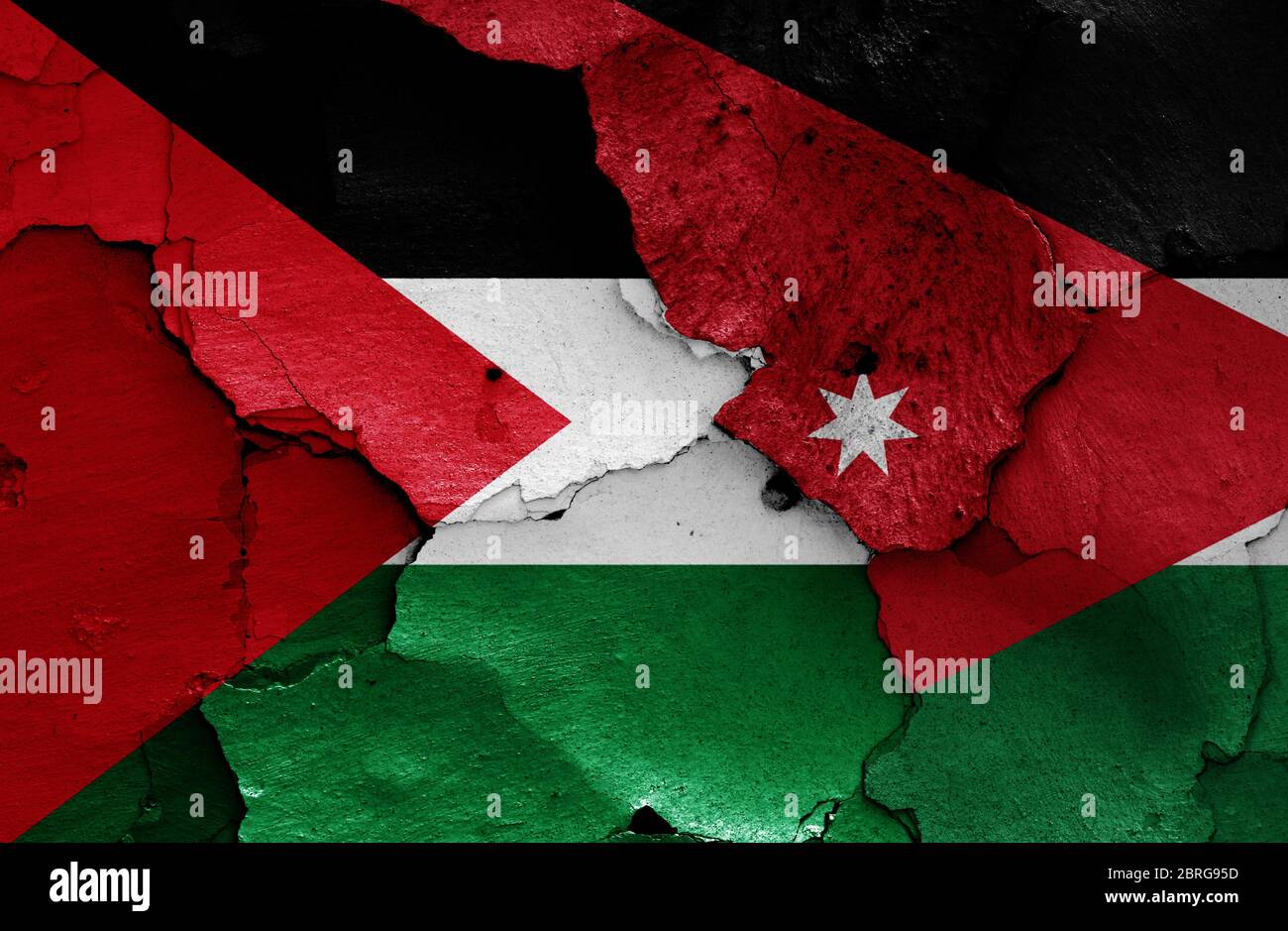 flags of Palestine and Jordan painted on cracked wall Stock Photo