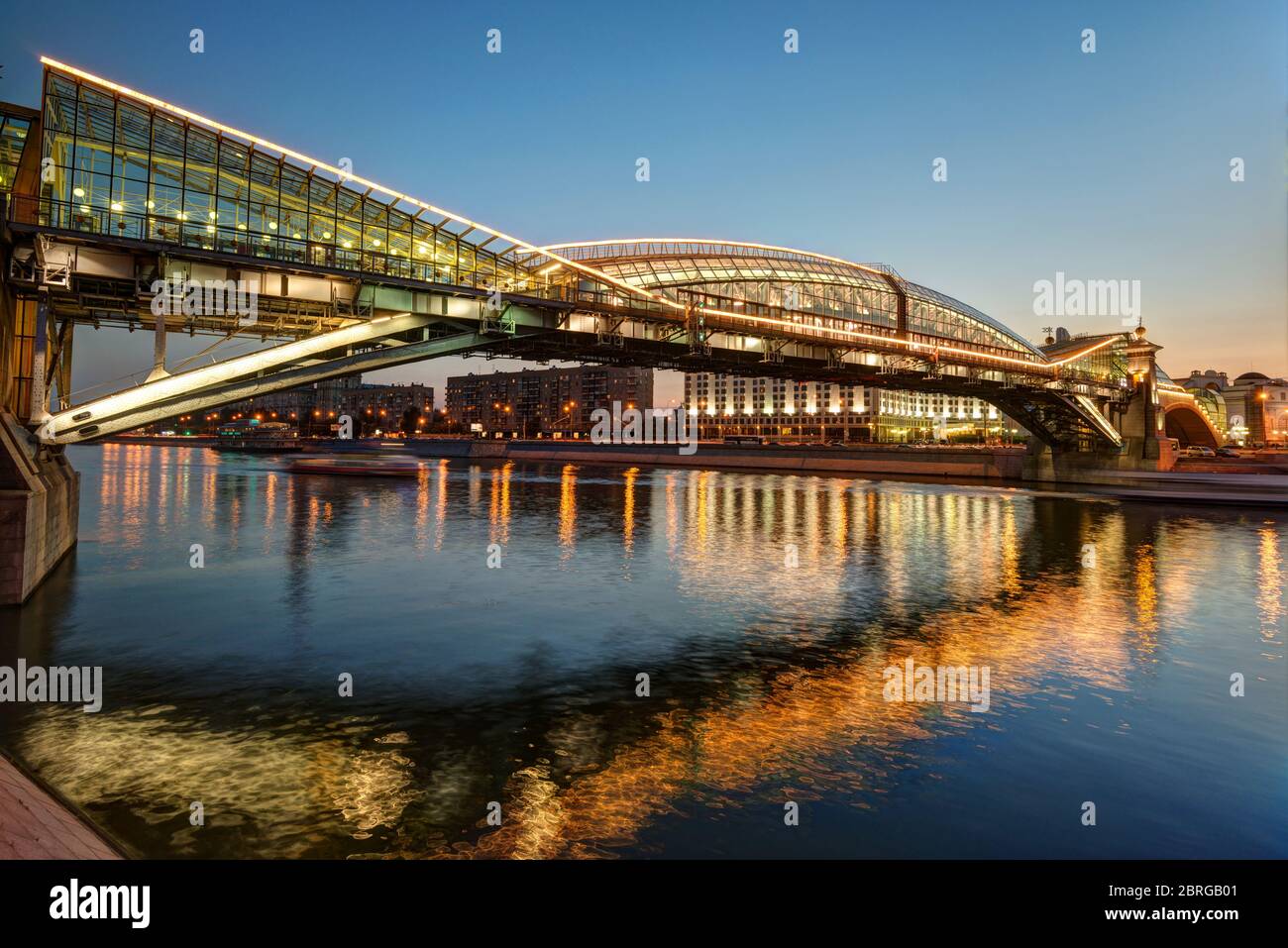 MOSCOW - AUGUST 20: Bogdan Khmelnitsky bridge at night on august 20, 2013 in Moscow. It is a beautiful pedestrian bridge across the Moscow River near Stock Photo