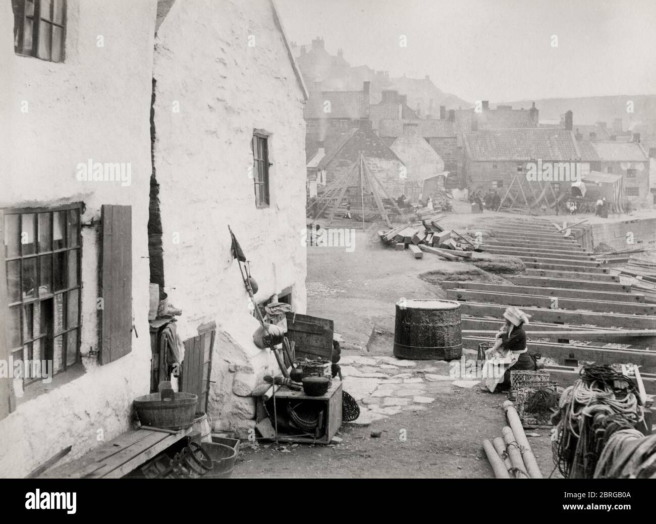 Building work along the seafront in the fishing village of Staithes, Yorkshire Stock Photo