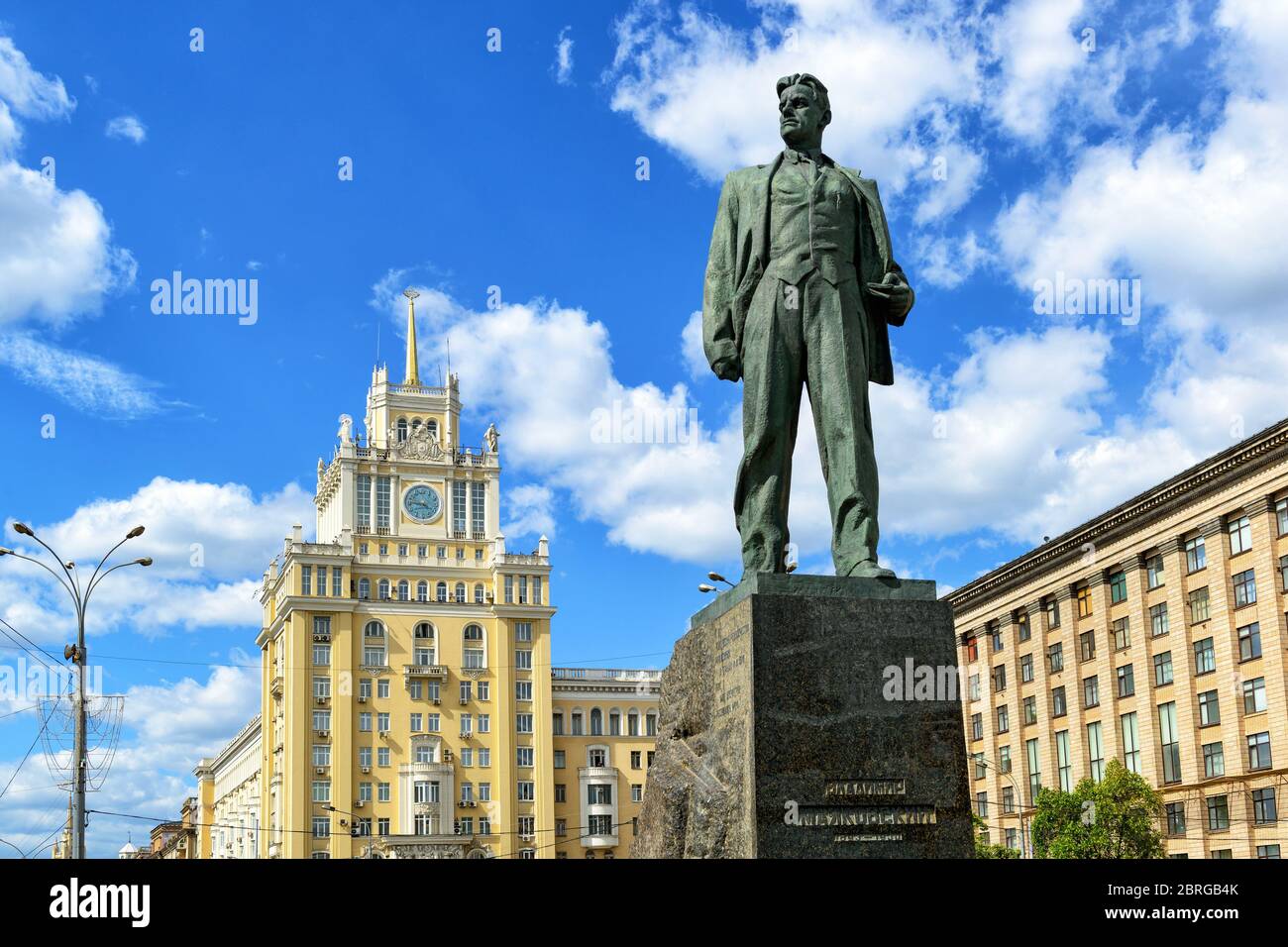 Monument to the Soviet poet Vladimir Mayakovsky and Hotel Beijing on Triumph Square. The monument was erected in 1958. Stock Photo