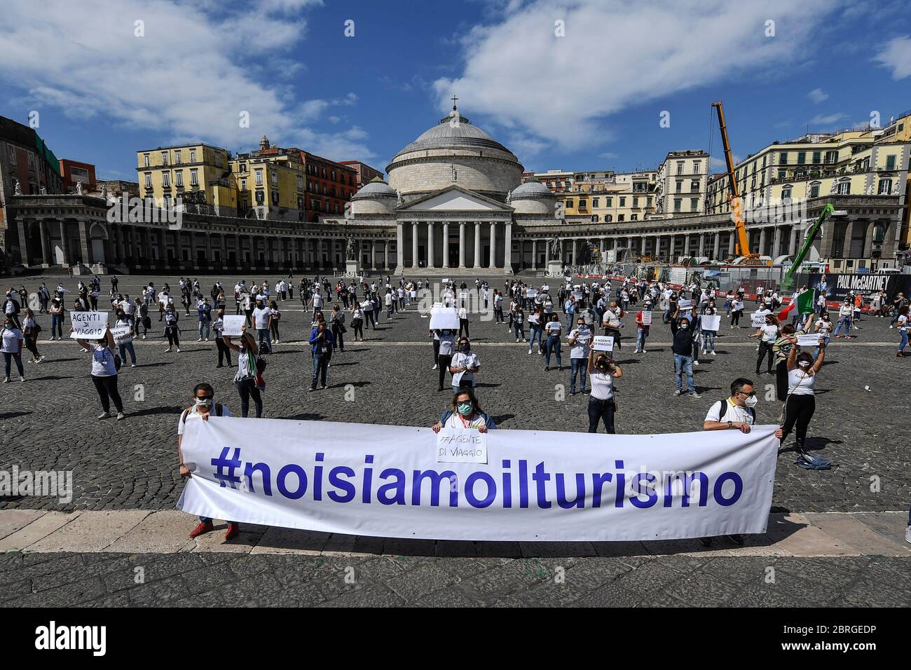 Tour operators take part in a demonstration in Piazza del Plebiscito to protest 'against the indifference of the government and local authorities' on the economic crisis that has been exacerbated by the coronavirus pandemic (COVID-19) in central Naples. Italy is gradually easing the blockade measures implemented to stem the spread of the SARS-CoV-2 coronavirus, which causes COVID-19 disease. Stock Photo