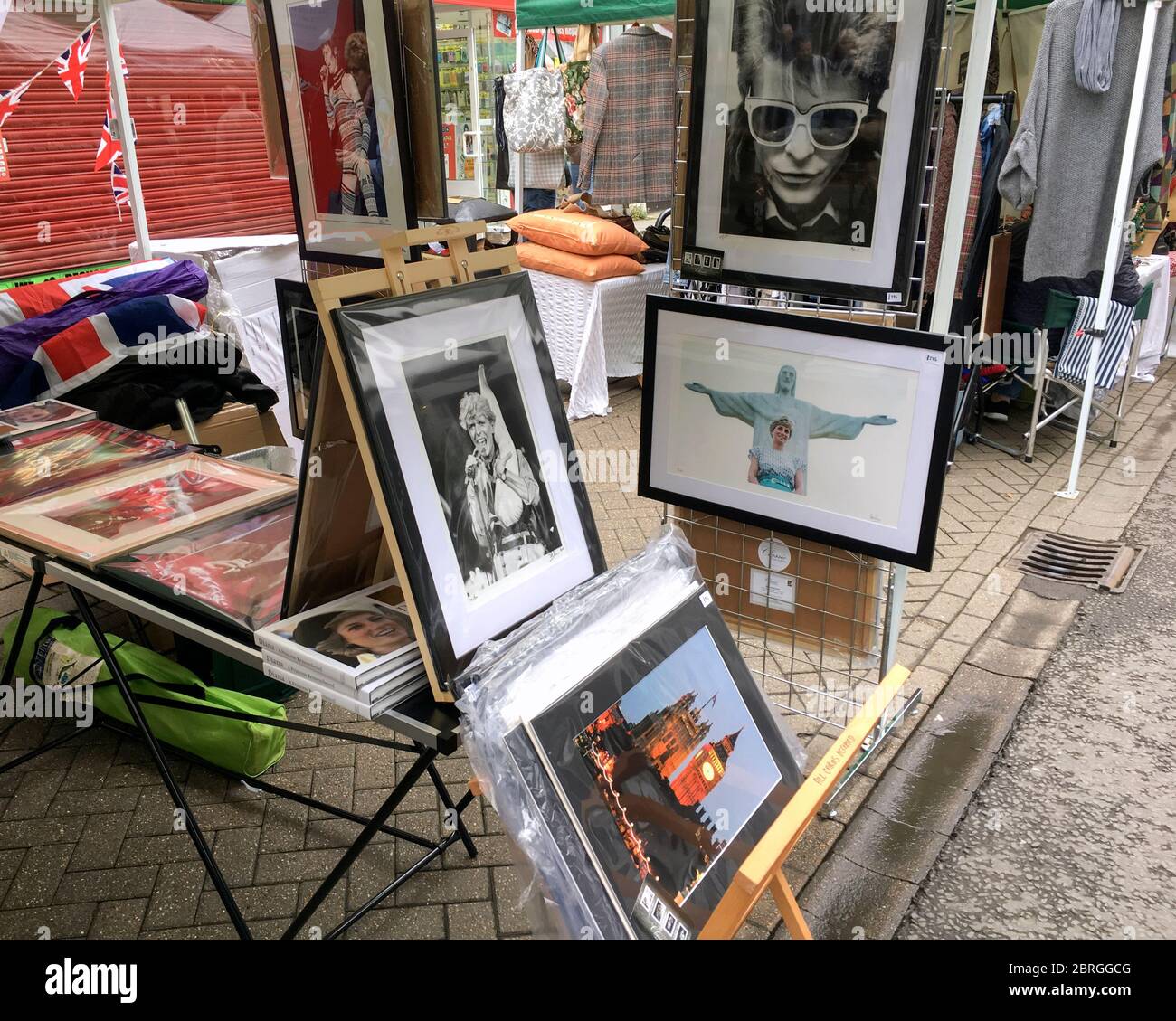 A fine art photography market stall selling framed archive photos of Royalty and celebrity including Princess Diana, David Bowie, HM Queen Elizabeth I Stock Photo