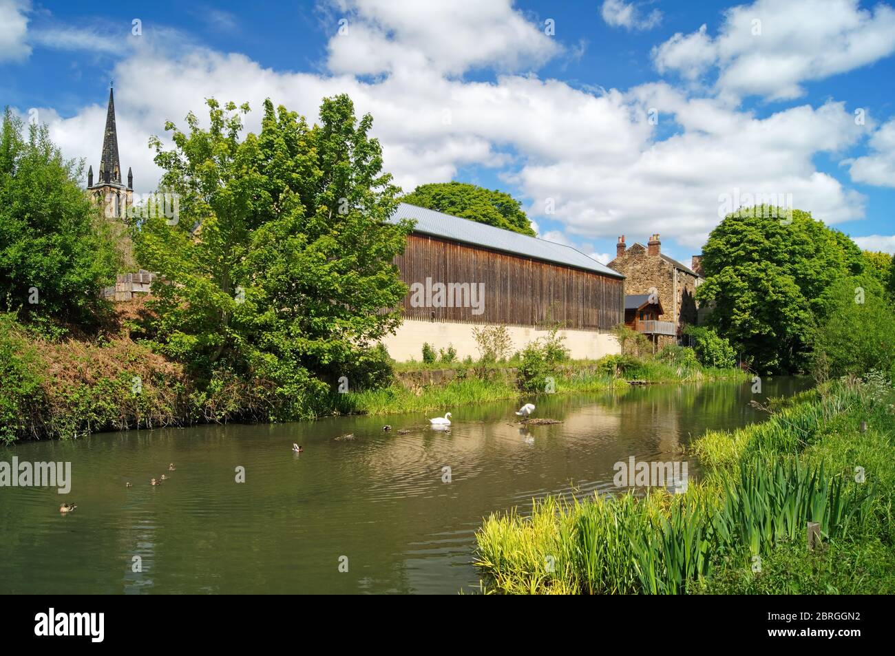 UK,South Yorkshire,Elsecar,Holy Trinity Parish Church and buildings next to Elsecar Canal Stock Photo