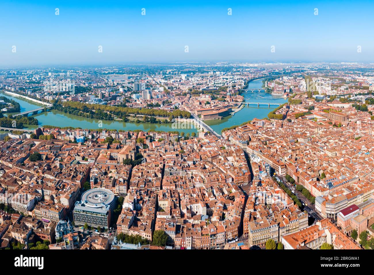 Toulouse and Garonne river aerial panoramic view. Toulouse is the capital of Haute Garonne department and Occitanie region in France. Stock Photo
