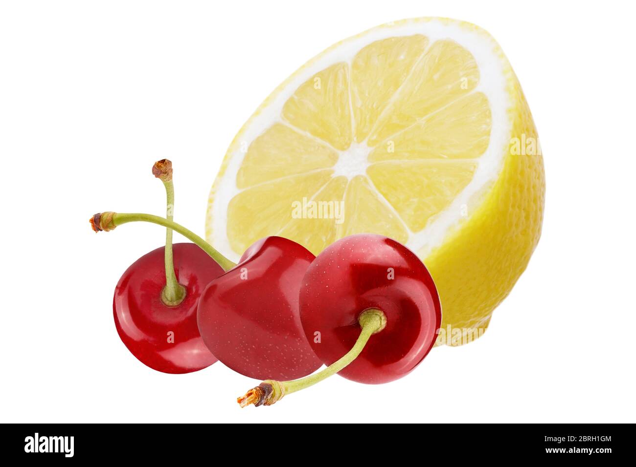 Isolated fruits. Fresh lemon and cherry fruits isolated on white background  with clipping path as package design element and advertising. full depth o  Stock Photo - Alamy
