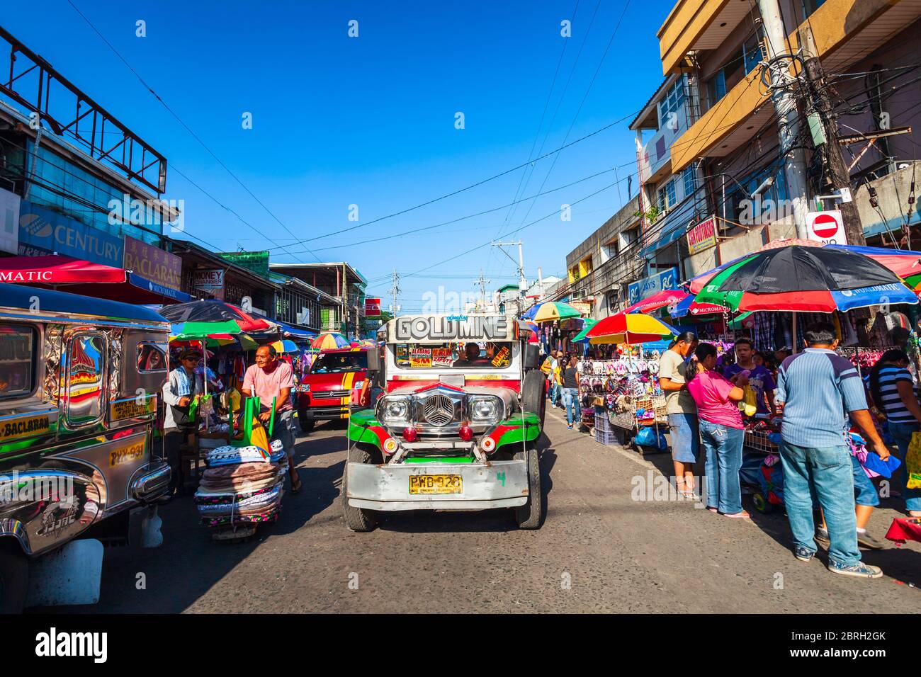 MANILA, PHILIPPINES - MARCH 17, 2013: Jeepneys are popular public transport in the Manila city in Philippines, they made from old US military jeeps Stock Photo