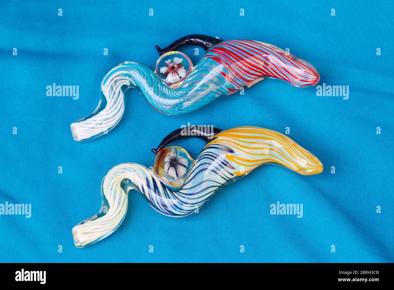 KATHMANDU, NEPAL - MAY 28, 2012: Exclusive design pipe for marijuana smoking on a blue fabric background Stock Photo