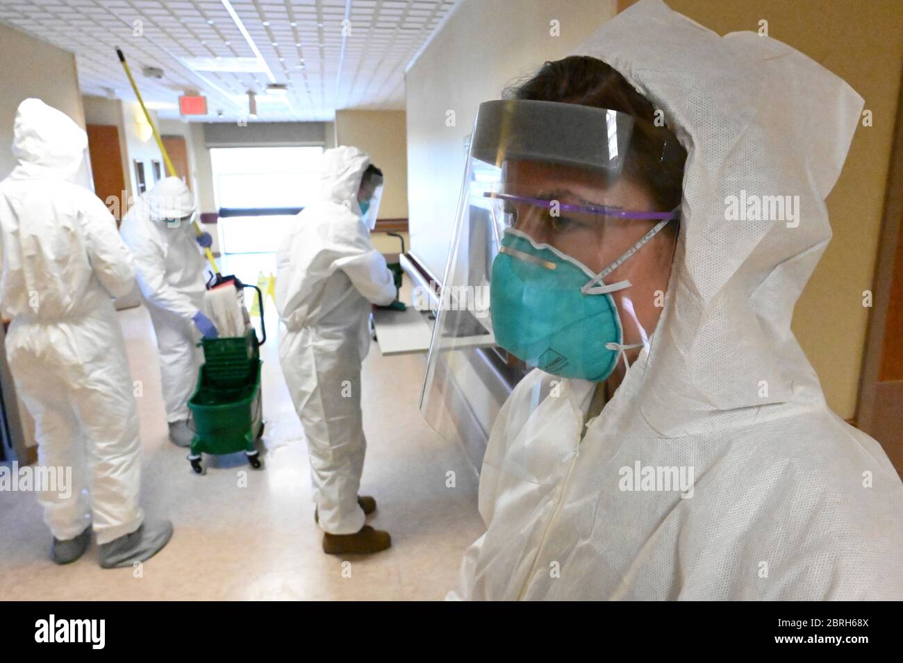 North Dakota National Guard airmen wear personal protective equipment as they sanitize a nursing home facility May 18, 2020 in Fargo, North Dakota. Stock Photo