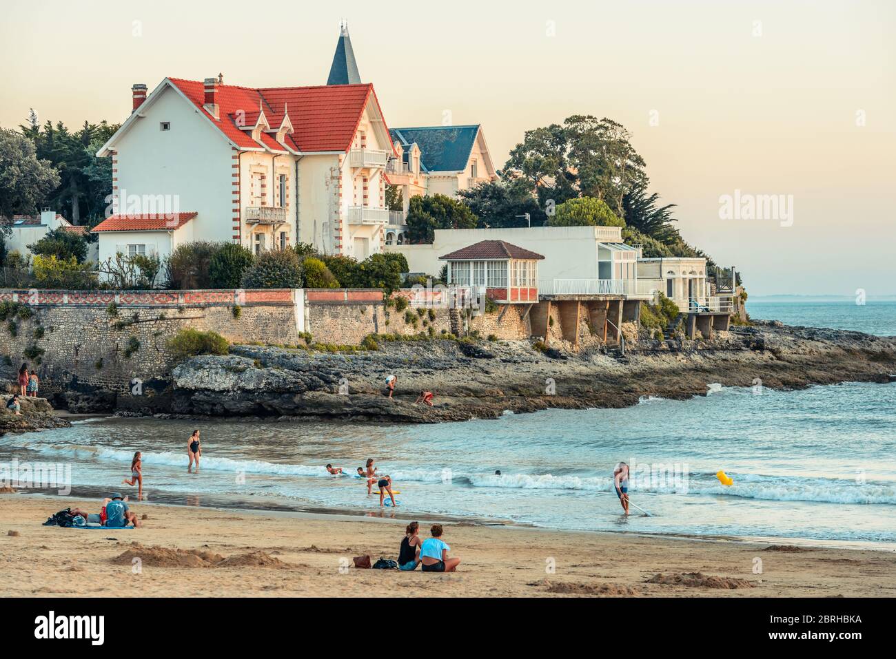 Saint-Palais-sur-Mer, France: A few people enjoy themselves on the Plage du  Bureau beach in the town centre at sunset Stock Photo - Alamy