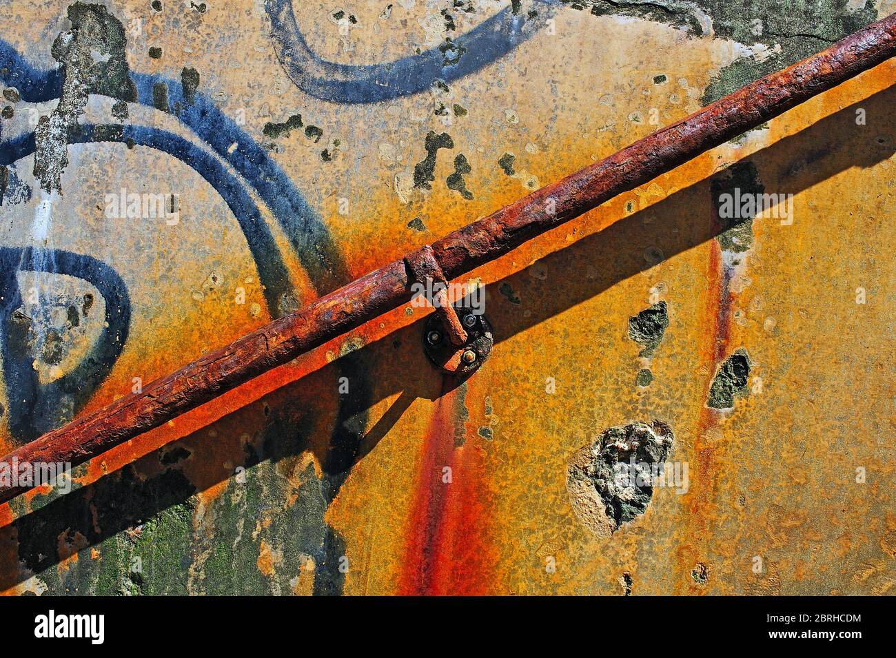 Plaform Handrail Rusting Old handrail attached to exterior weathered wall covered in graffiti ...