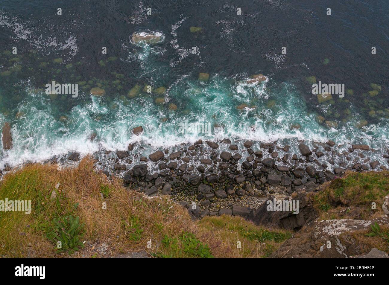 Top view of the waves crashing on the cliff of the Isle of Skye, Scotland Stock Photo