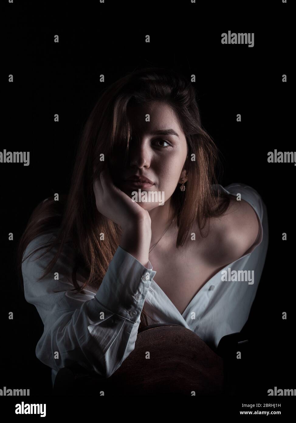 Model Over Solid Background Beautiful model posing over black background. Portrait Stock Photo - Alamy