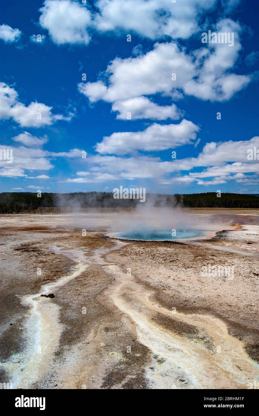 Small Blue Hot Spring under a Cludy Sky Stock Photo