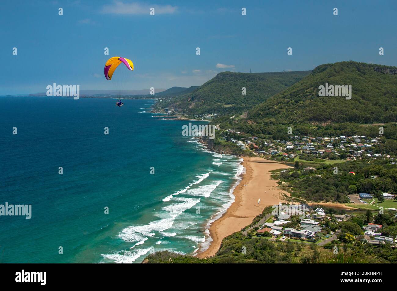 Aerial view coastline  with hang glider Stanwel Park Beach NSW Australia Stock Photo