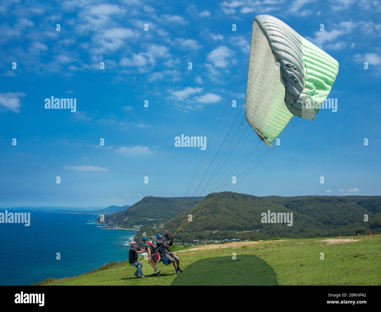 Launching a hang glider fron Bald Hill Stanwell Park NSW Australia Stock Photo