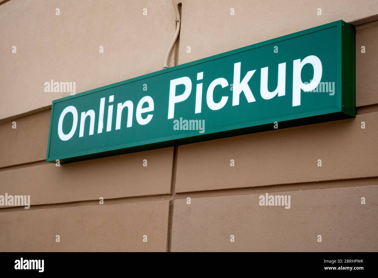 Sign noting a place to park to pick up food at grocery for socially distance during quartine for COVID-19 corona virus. St Paul Minnesota MN USA Stock Photo