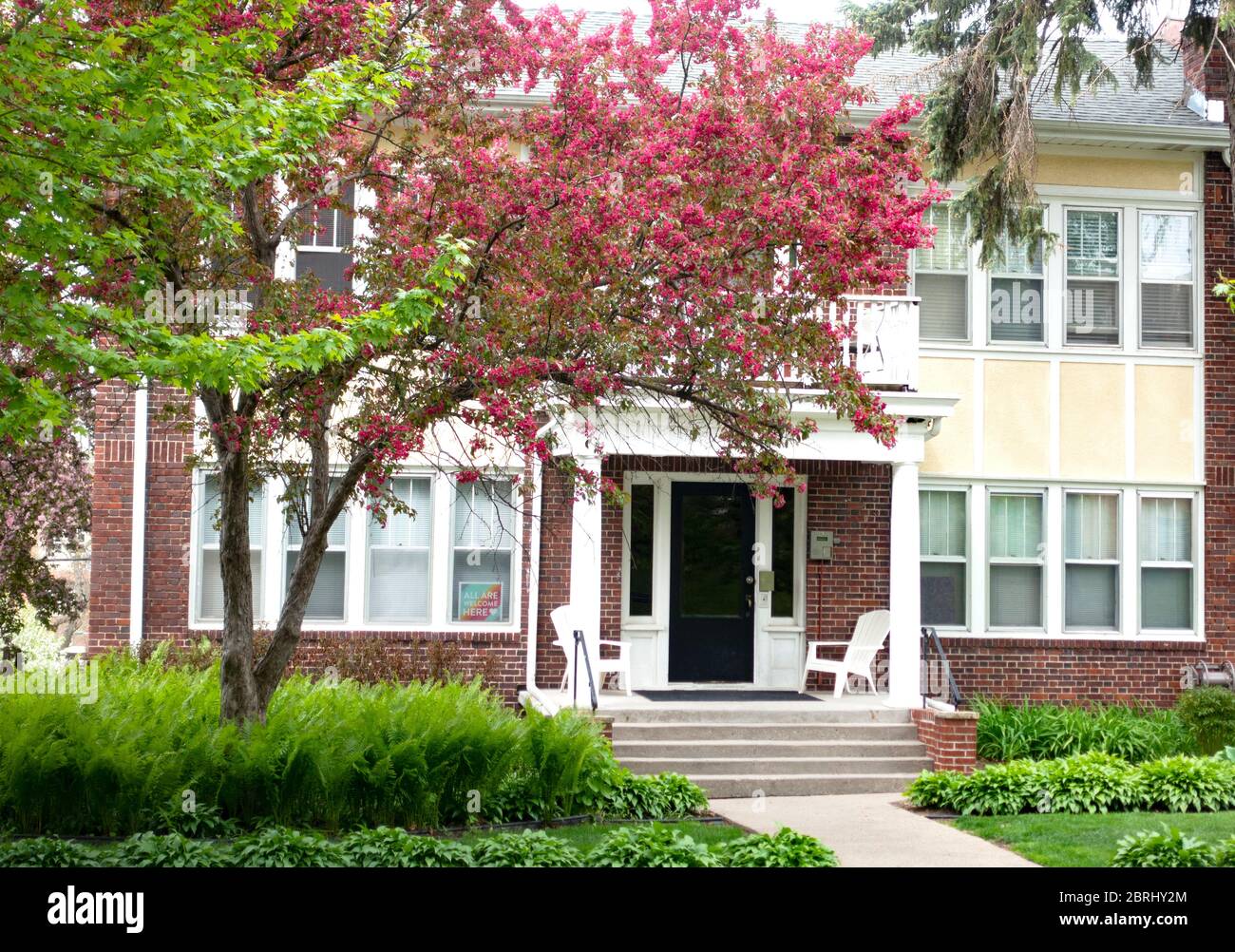 Photo inspiration: Gallery Detail: Attractive Apartment Building With A Pink Blooming Fruit Tree And