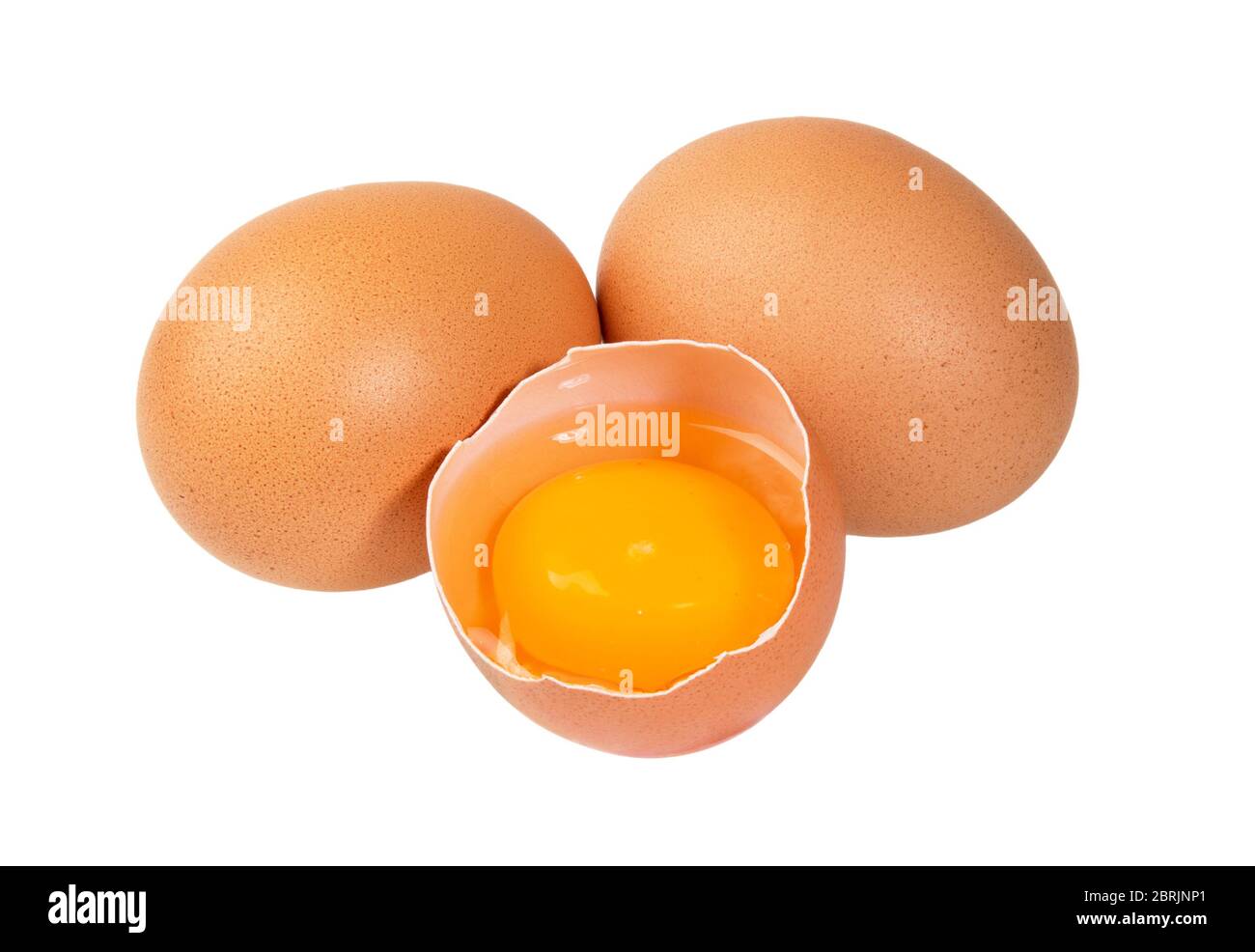 Broken chicken egg with yolk isolated on white background. Raw egg. Stock Photo