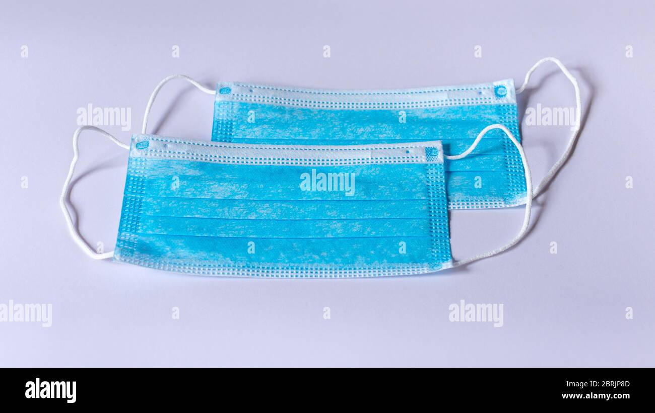 Two Surgical protective Face Masks isolated on a white background Stock ...