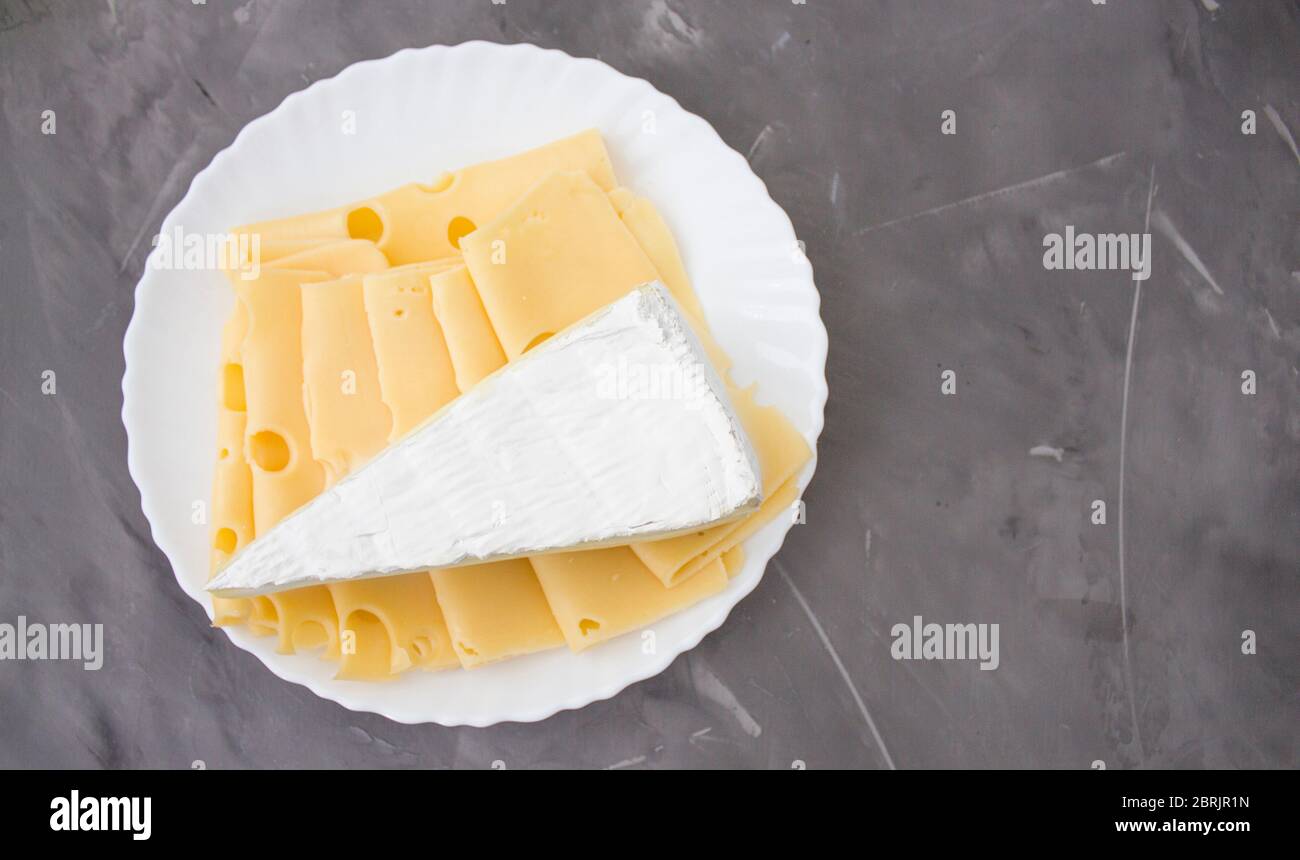 Slices of cheese, medium hard cheese, homemade or Swiss cheese and hard