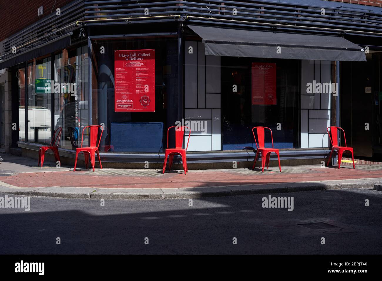 A restaurant with chairs set out for social distancing in Dublin city, Ireland during the coronavirus pandemic. Stock Photo