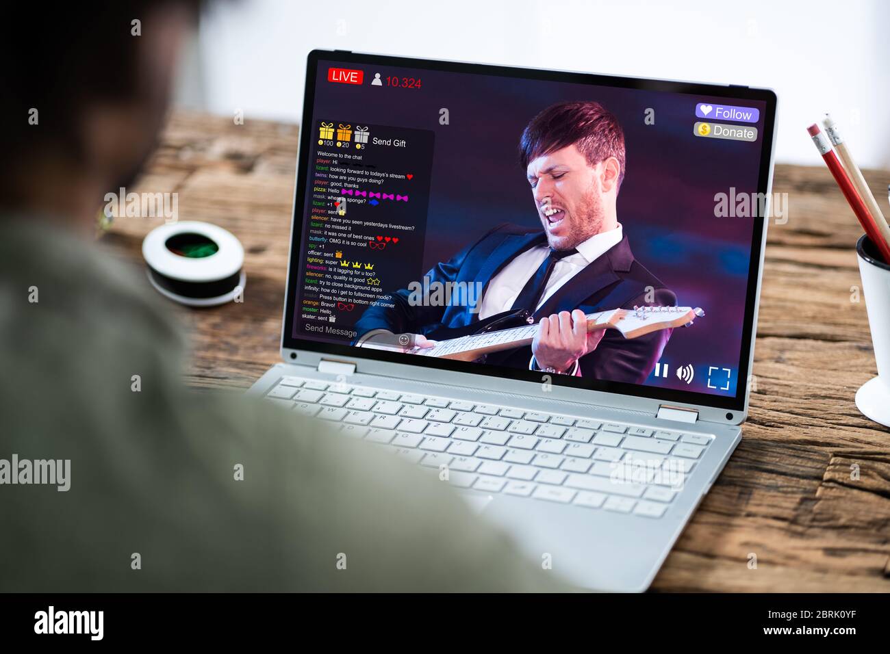 Streaming Live Music Video With Singer On Laptop Computer Stock Photo