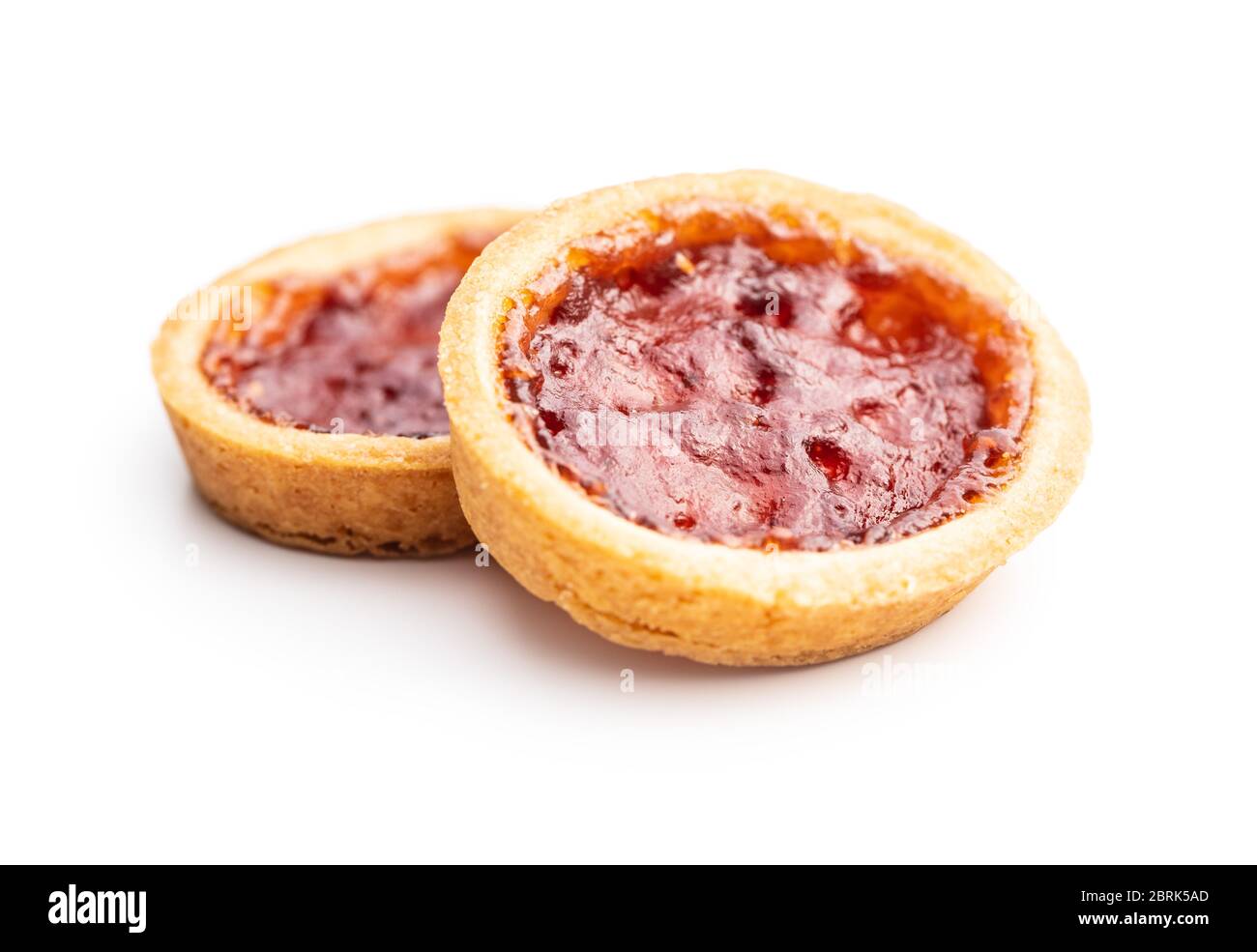 Sweet biscuits with strawberries jam isolated on white background. Stock Photo