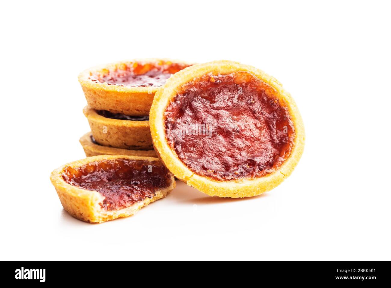 Sweet biscuits with strawberries jam isolated on white background. Stock Photo