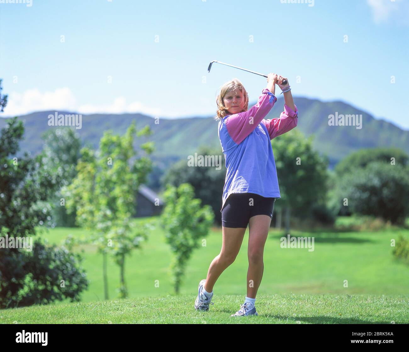 Teenage girl playing golf, Leinster Province, Republic of Ireland Stock Photo