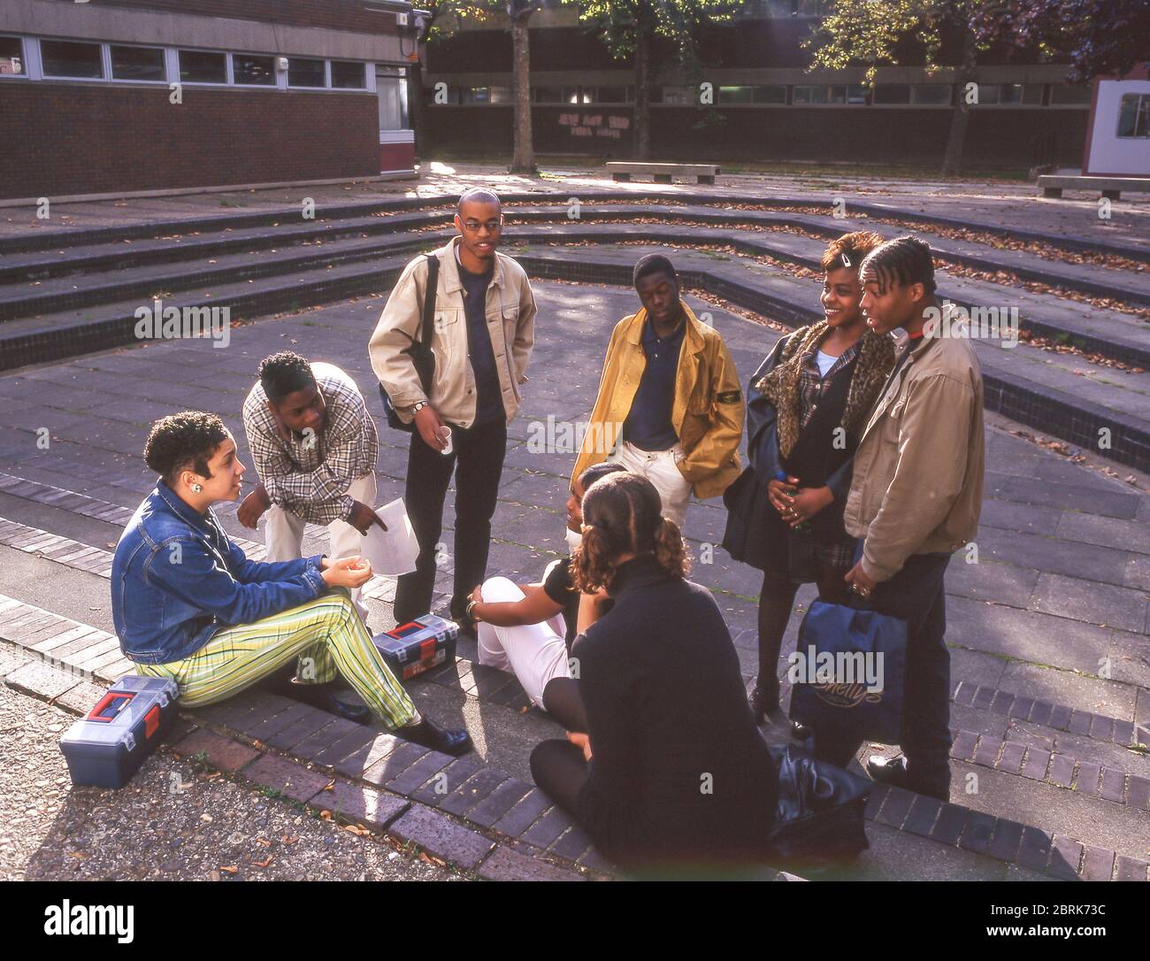 College group gathered on university campus, Surrey, England, United Kingdom Stock Photo