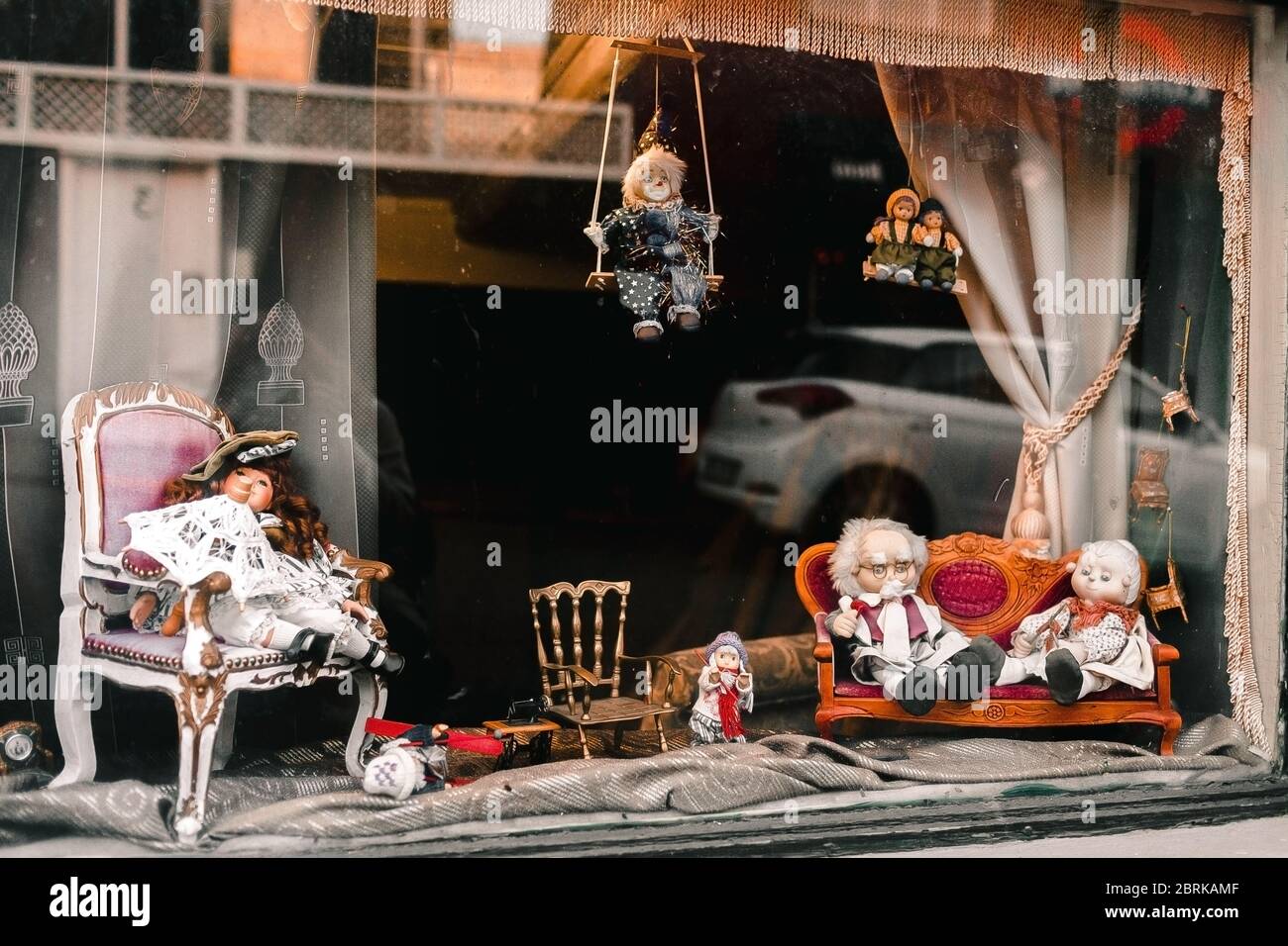 View of a puppet store window, full of old, dusty toys. childhoods. antic Stock Photo Alamy