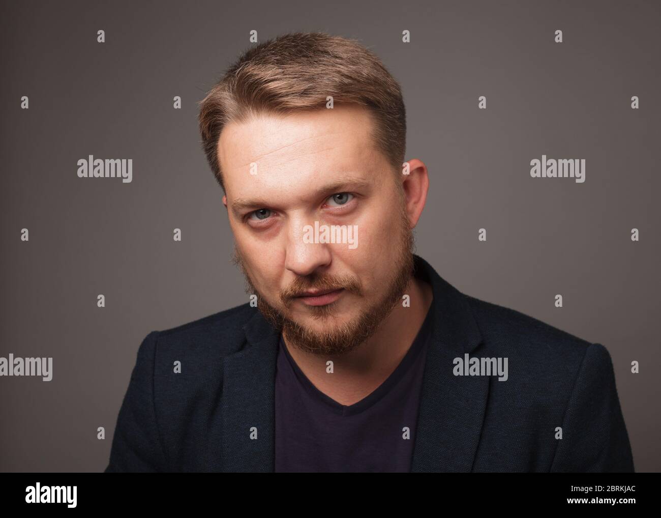 Man looking at camera with a sad look. Stock Photo