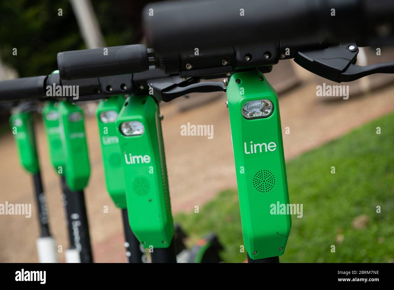 Washington, USA. 21st May, 2020. A general view of a line of Lime dock-less rental scooters in Washington, DC, on May 21, 2020 amid the Coronavirus pandemic. This week, the confirmed U.S. death toll from COVID-19 neared 100,000, while many states push to reopen their economies despite not meeting requirements recommended by public health experts for safe reopening. (Graeme Sloan/Sipa USA) Credit: Sipa USA/Alamy Live News Stock Photo