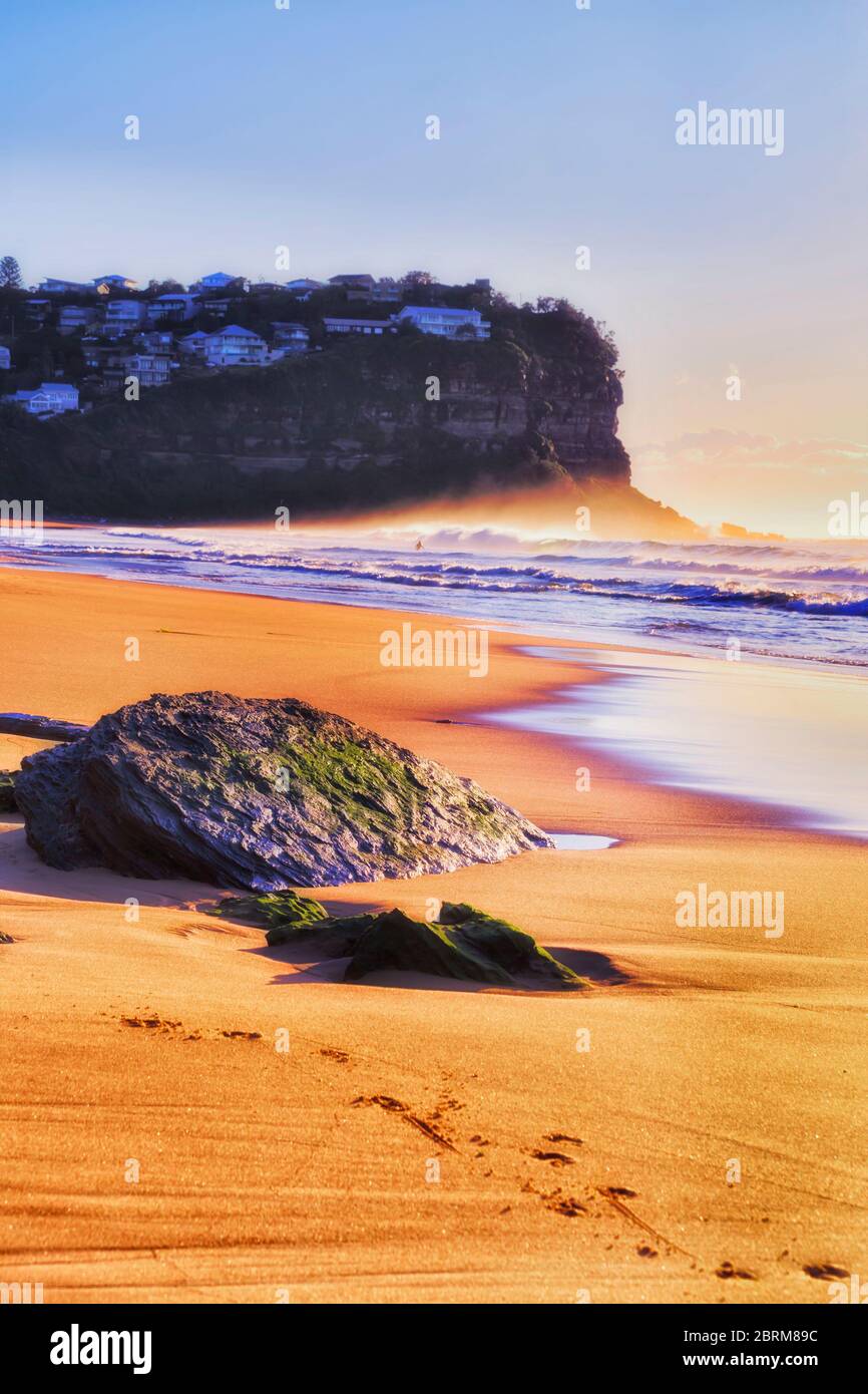 Yellow clean beach sand on Sydney Northern beaches in soft morning