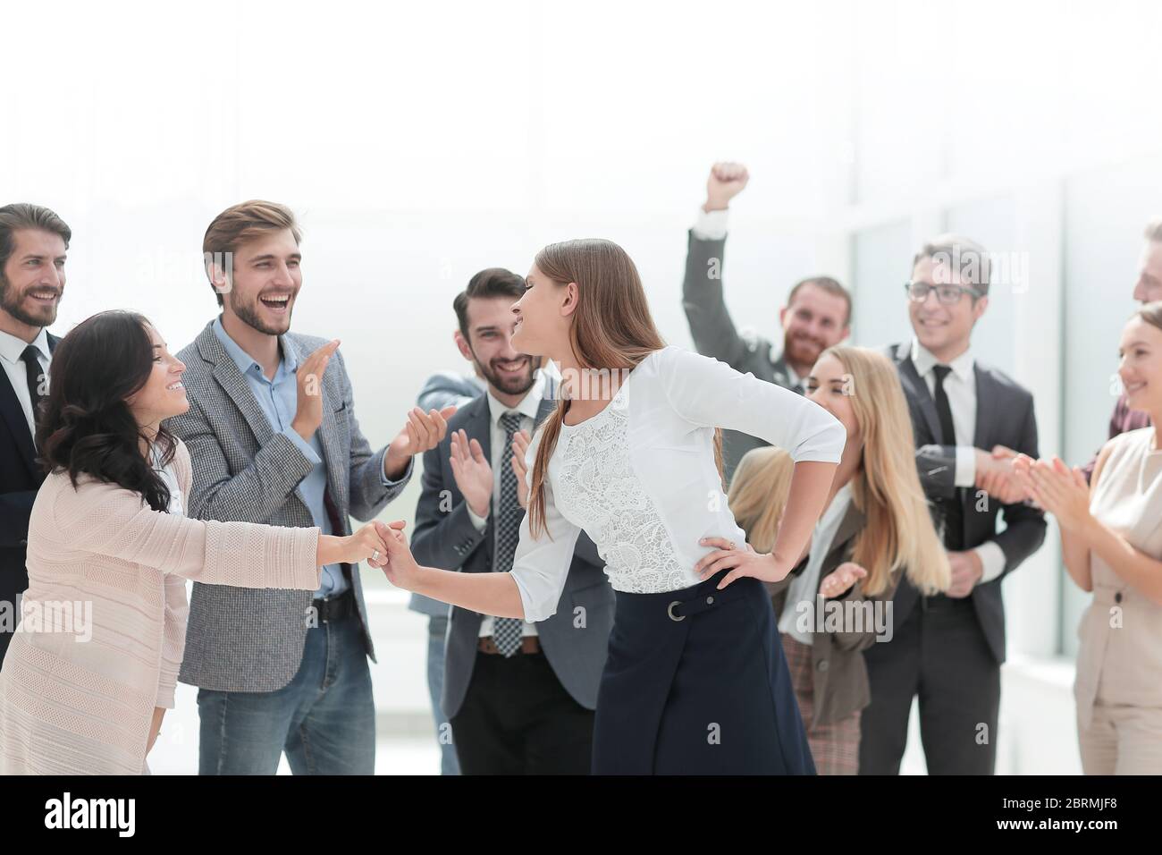 happy employees congratulating their leader. the concept of victory ...