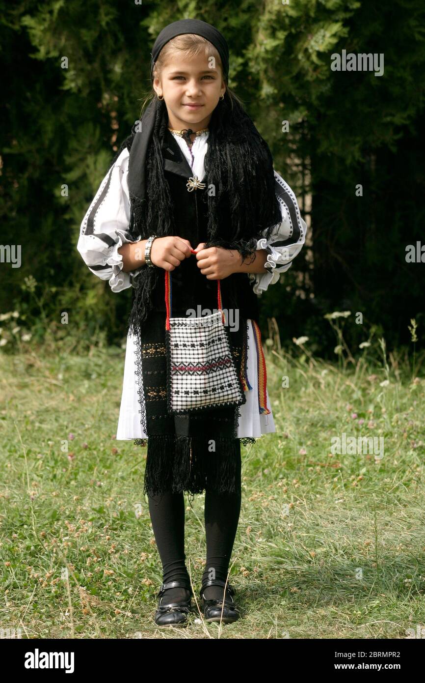 Folk festival in Gura Raului, SB, Romania: Sarbatoarea Portului Popular. Young girl in traditional costume. Stock Photo