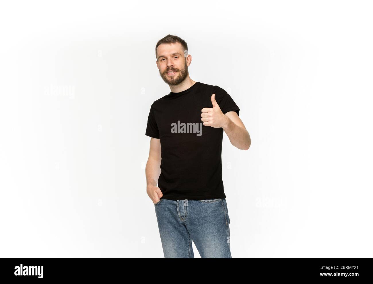 Closeup of young man's body in empty black t-shirt isolated on white background. Clothing, mock up for disign concept with copy space. Advertising con Stock Photo