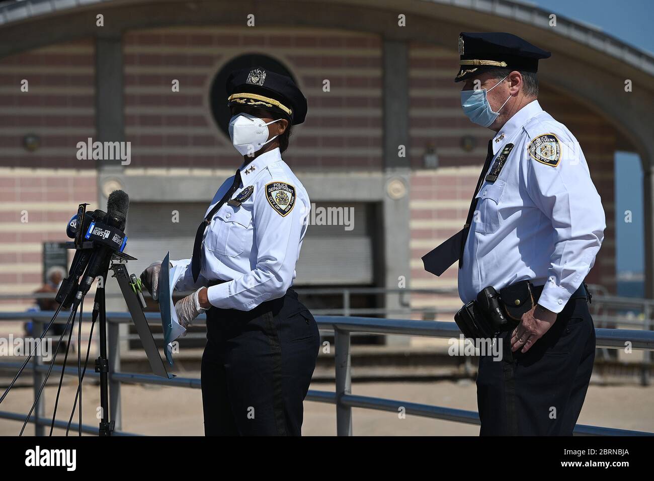 (L-R) NYPD officers Juanita Holmes, Commanding Officer of the School Safety Division and Brian Conroy, Assistant Chief of Patrol Borough Brooklyn South, hold a joint press conference along the Coney Island boardwalk, regarding security measures that will be in place during the upcoming Memorial Day weekend, in the Brooklyn borough of New York City, NY, May 21, 2020. NYPD officers will be patrolling the beaches for proper social distancing and handing out masks and beachgoers will only be able to enter water ankle deep. (Anthony Behar/Sipa USA) Stock Photo