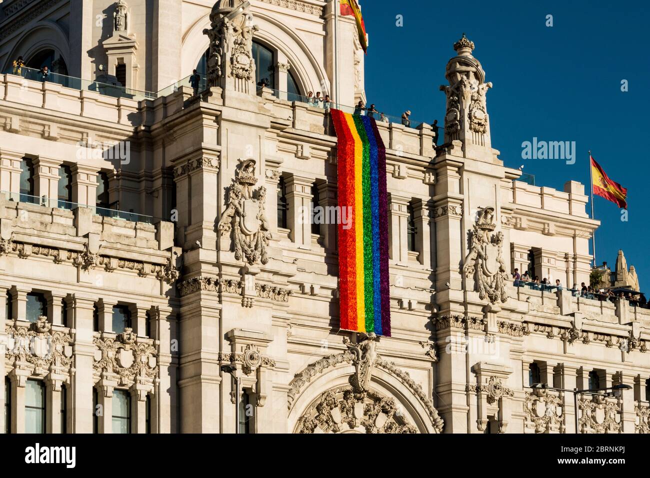 The Madrid Ayuntamiento building displays the LGBT flag during the celebration of the Gay Pride Stock Photo