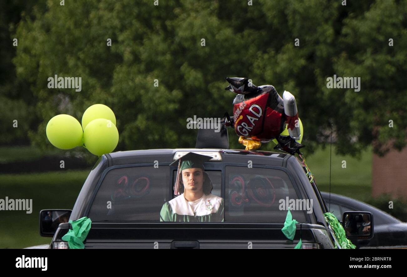 Washington, Untied States. 21st May, 2020. A decorated truck pulls out of the parking lot during a drive-through graduation ceremony at Musselman High School in Inwood, West Virginia on Thursday, May 21, 2020. Due to the COVID-19 pandemic the high school was forced to hold a social-distanced commencement ceremony. Photo by Kevin Dietsch/UPI Credit: UPI/Alamy Live News Stock Photo