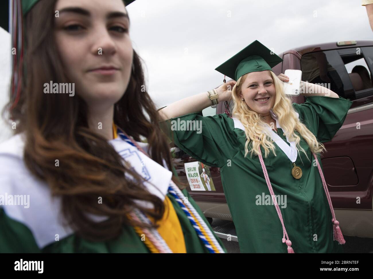 Washington, United States. 21st May, 2020. Member of the class of 2020 gather before the start of their drive-through graduation ceremony at Musselman High School in Inwood, West Virginia on Thursday, May 21, 2020. Due to the COVID-19 pandemic the high school was forced to hold a social-distanced commencement ceremony. Photo by Kevin Dietsch/UPI Credit: UPI/Alamy Live News Stock Photo