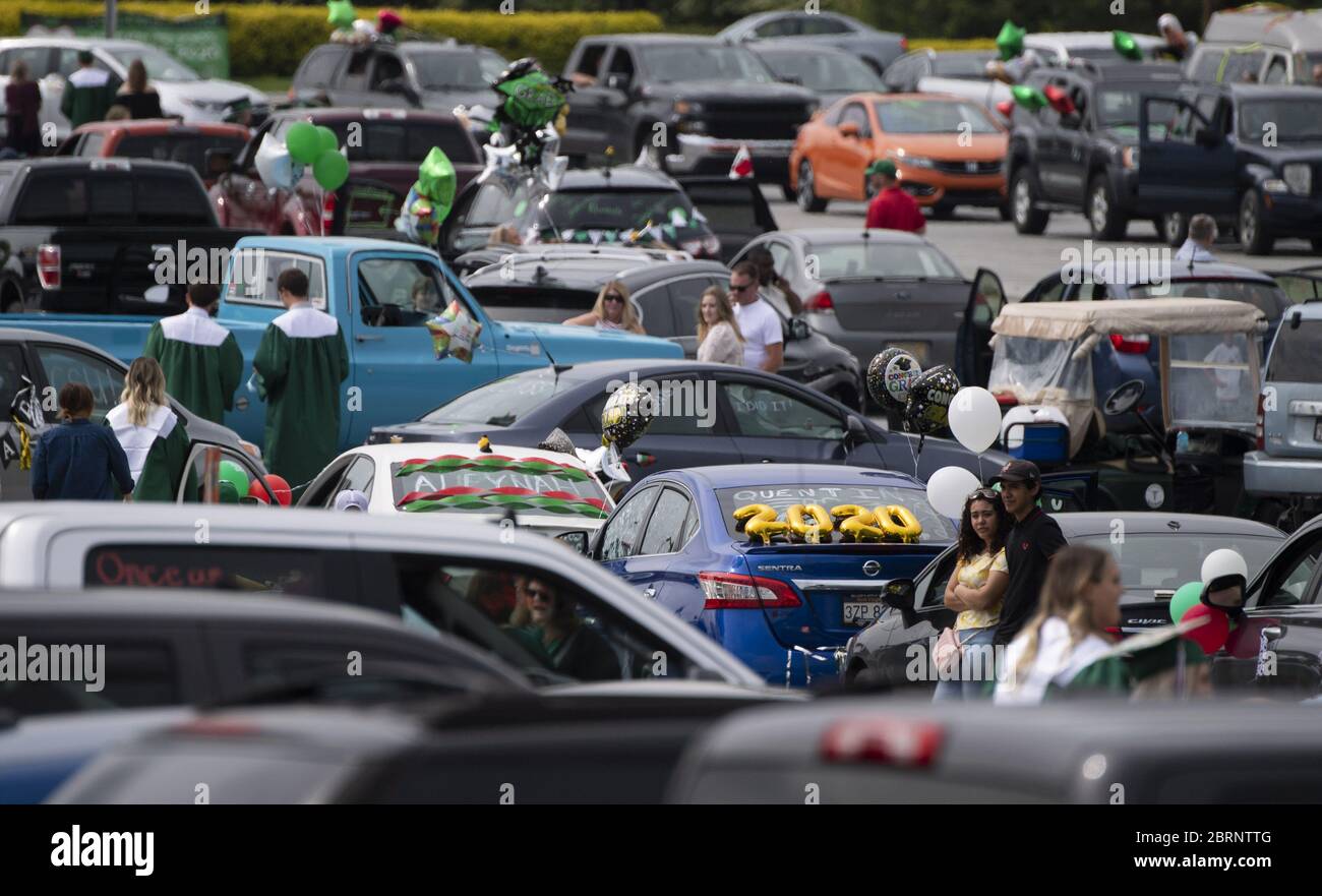 Washington, United States. 21st May, 2020. Members of the class of 2020 gather prior to the start of their the drive-through graduation ceremony at Musselman High School in Inwood, West Virginia on Thursday, May 21, 2020. Due to the COVID-19 pandemic the high school was forced to hold a social-distanced commencement ceremony. Photo by Kevin Dietsch/UPI Credit: UPI/Alamy Live News Stock Photo
