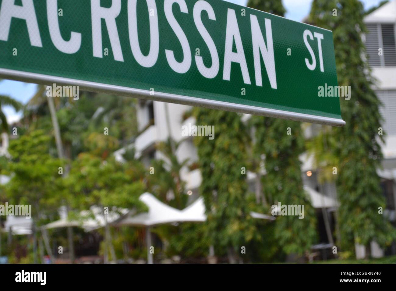 Signpost or road sign for the famous shopping boutique strip called Macrossan Street in Port Douglas, Queensland Stock Photo