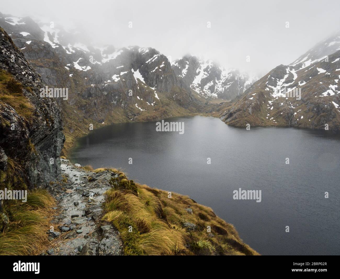 The Routeburn track in bad weather above Lake Harris, Mount Aspiring National Park, New Zealand