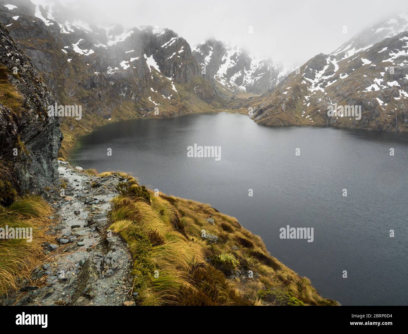 The Routeburn track in bad weather above Lake Harris, Mount Aspiring National Park, New Zealand