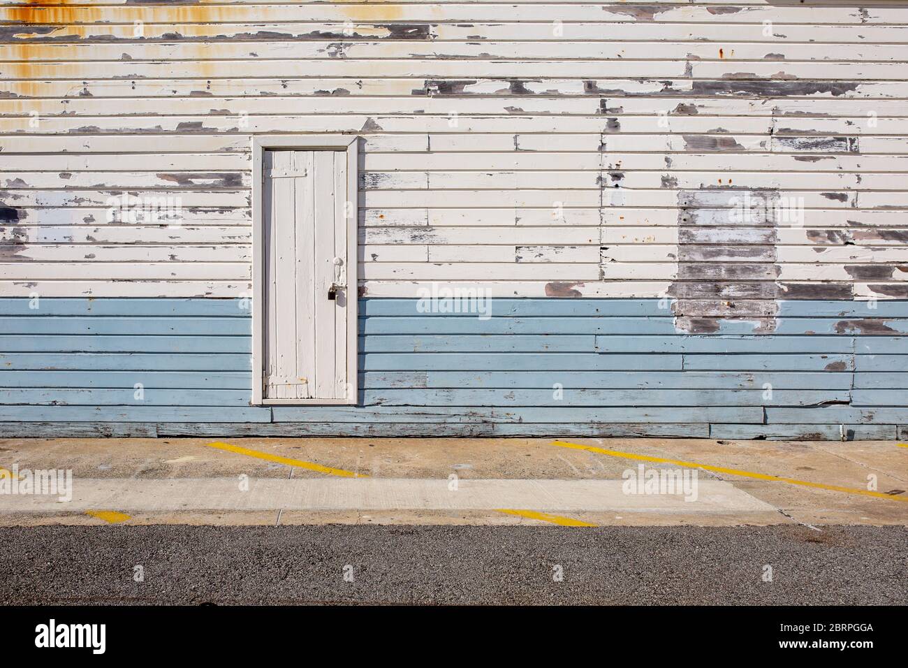 Old weathered wooden door into wooden building Stock Photo