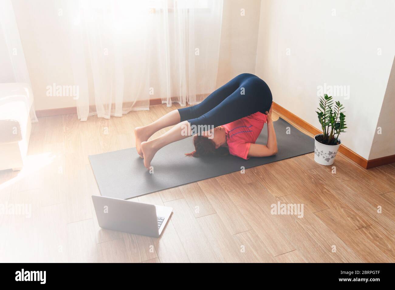 Premium Photo  Young korean lady standing in plank position on yoga mat  exercising at home in living room interior