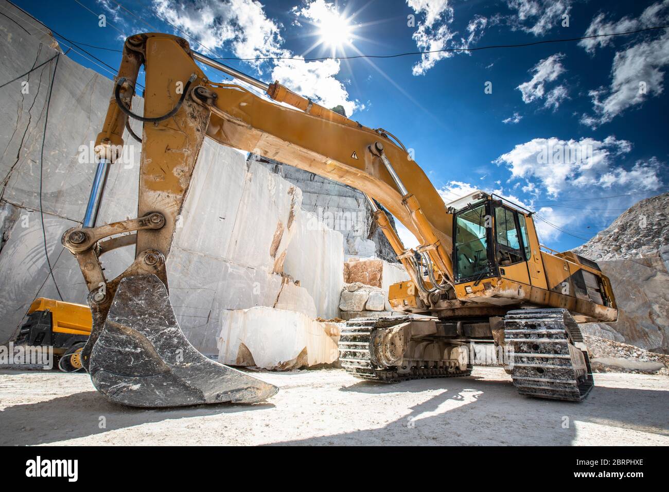 High stone mountain and marble quarries in the Apennines in Tuscany,  Carrara Italy. Open marble mining. Stock Photo